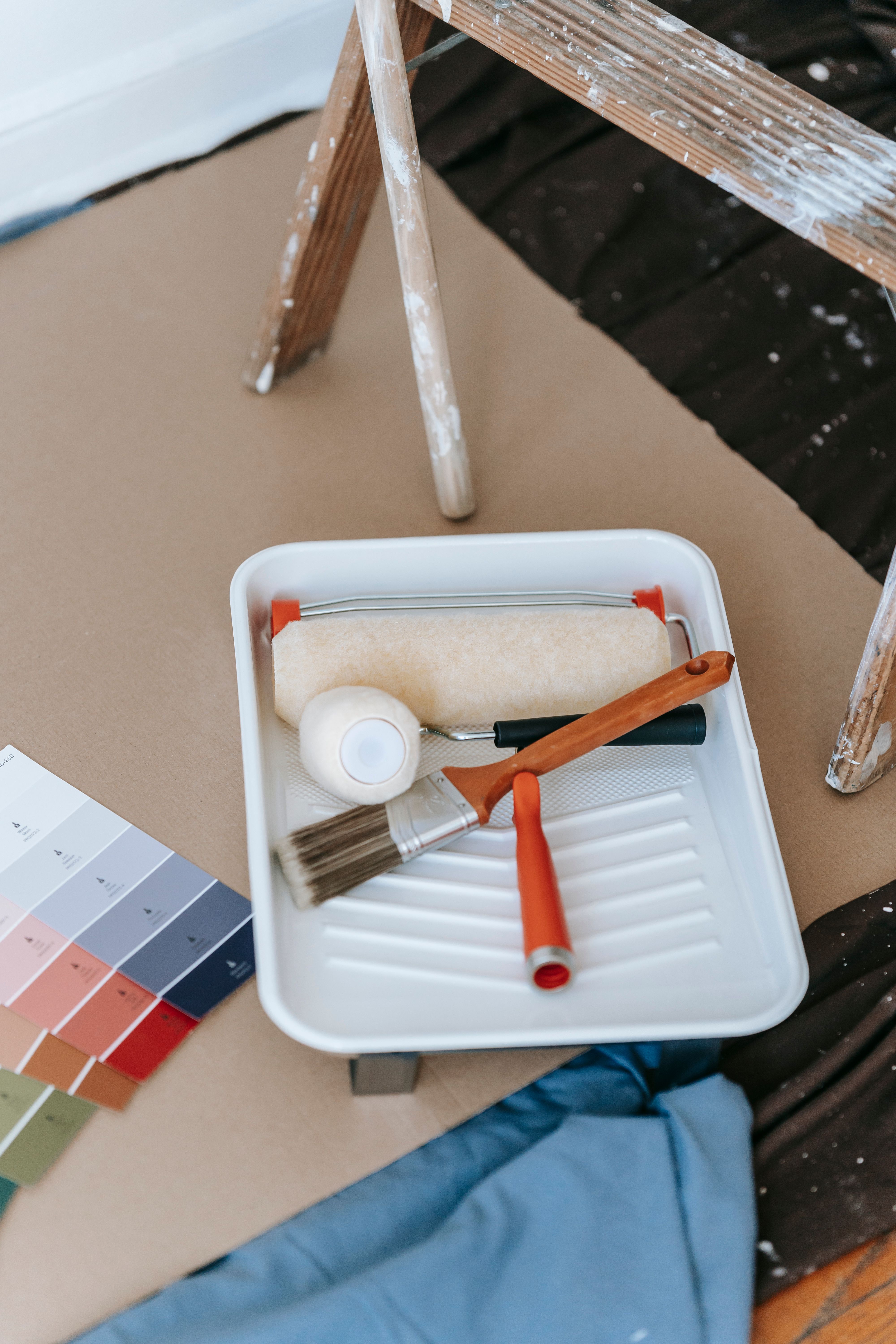 Paint roller and brush inside tray